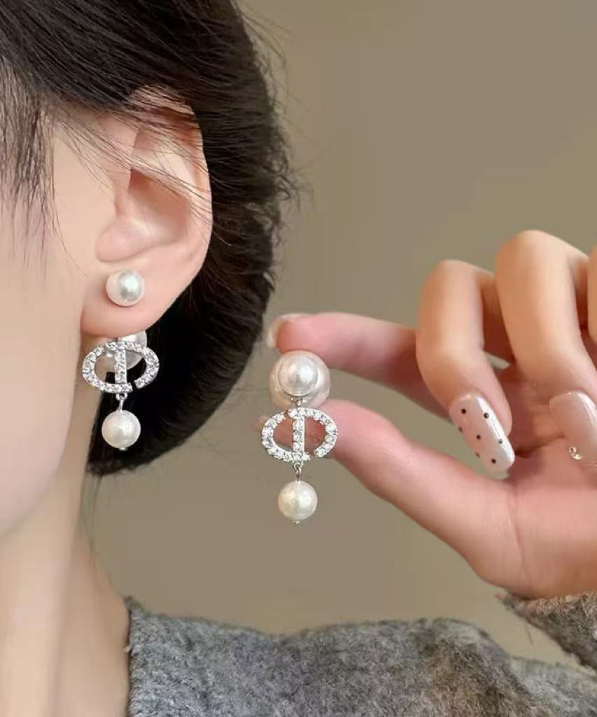 Elegante Ohrhänger aus Gold-Kupfer-Legierung mit Zirkonia und Perlen