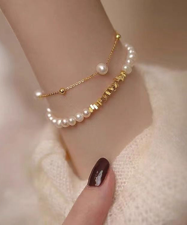 Stilvolles zweiteiliges Charm-Armband-Set aus vergoldeten Kupferperlen mit zerkleinerter Silberquaste