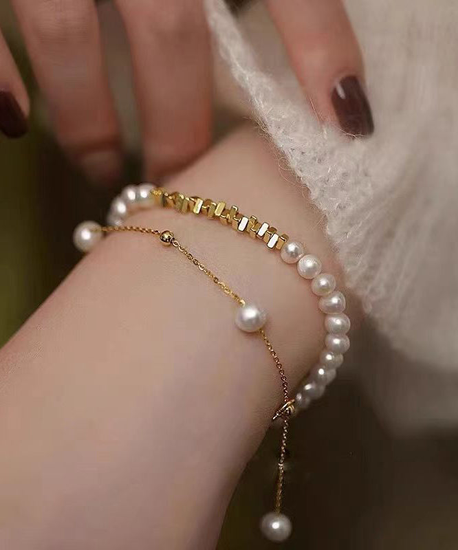 Stilvolles zweiteiliges Charm-Armband-Set aus vergoldeten Kupferperlen mit zerkleinerter Silberquaste