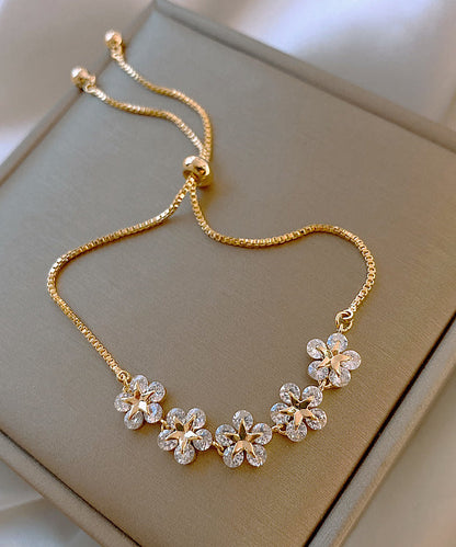 Stilvolles Gold-Kupfer-Overgild Zirkon Blumen Charm Armband