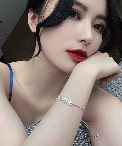 Stilvolles Gold-Kupfer-Overgild Zirkon Blumen Charm Armband