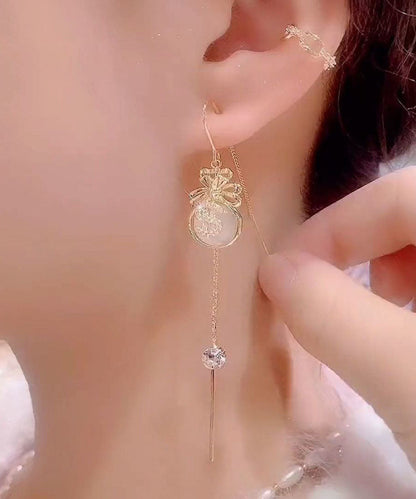 Elegantes pendientes colgantes con borlas y circonitas doradas