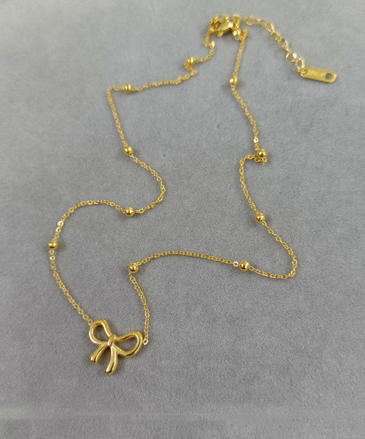 Elegante Halskette mit Schleifenanhänger aus goldfarbenem Edelstahl