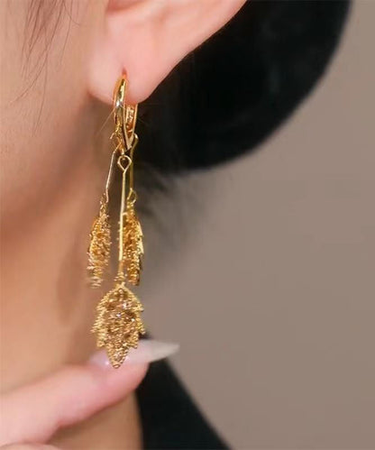 Elegantes pendientes colgantes con borlas de hojas de circonitas doradas y plata de ley