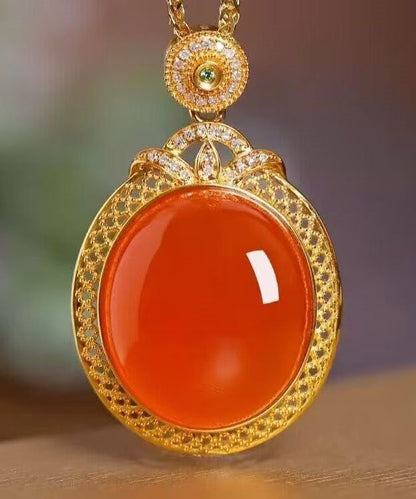 Elegante collar con colgante de ágade con incrustaciones de plata de ley dorada