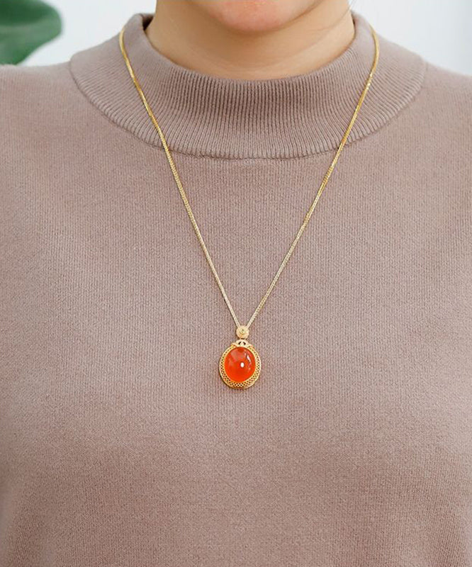 Elegante collar con colgante de ágade con incrustaciones de plata de ley dorada