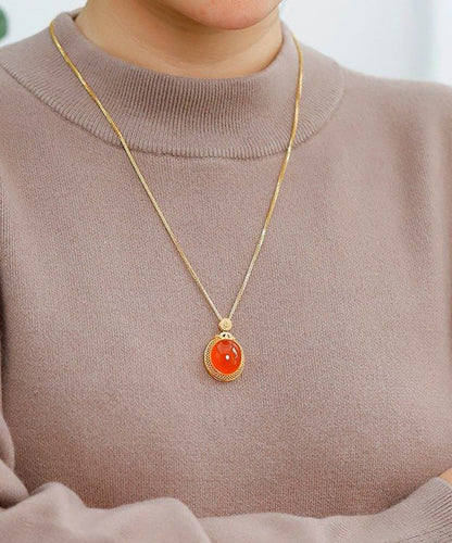 Elegante collar con colgante de ágade con incrustaciones de plata de ley dorada