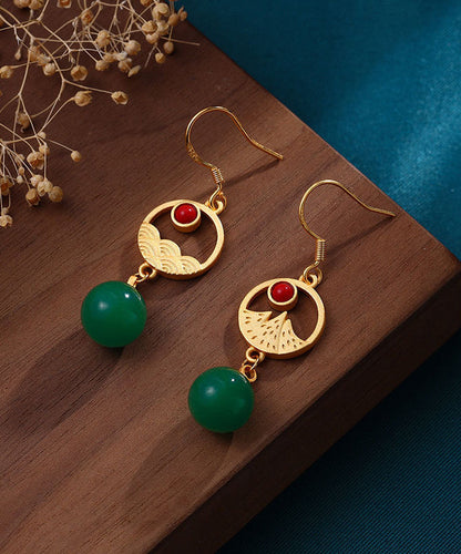 Stilvolle Creolen mit eingelegter grüner Achatperle und Asymmetrie