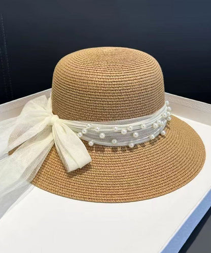 Sombrero para el sol flexible tejido de paja con cuentas y lazo color caqui con estilo