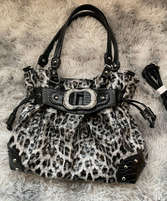 Elegante bolso de piel sintética con cordón morado