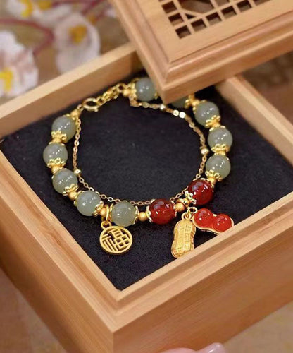 Stilvolles rotes Jade-Erdnuss-Quasten-Charm-Armband aus 18 Karat Gold