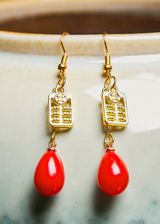 Elegantes aretes colgantes de ábaco en oro de 14 quilates y coral rojo