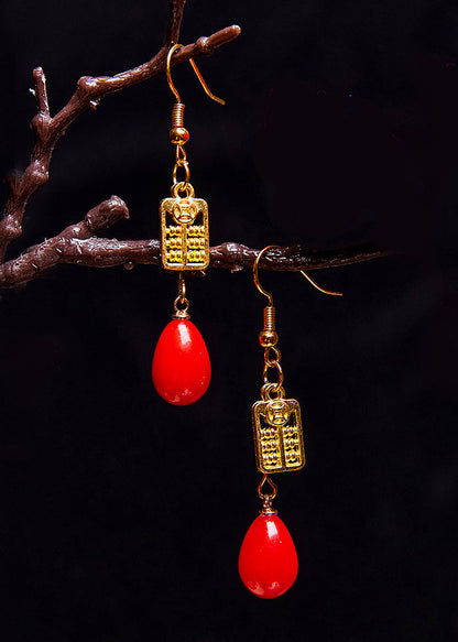 Elegantes aretes colgantes de ábaco en oro de 14 quilates y coral rojo