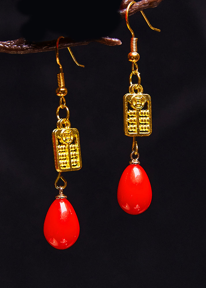 Elegantes aretes colgantes de ábaco en oro de 14 quilates y coral rojo