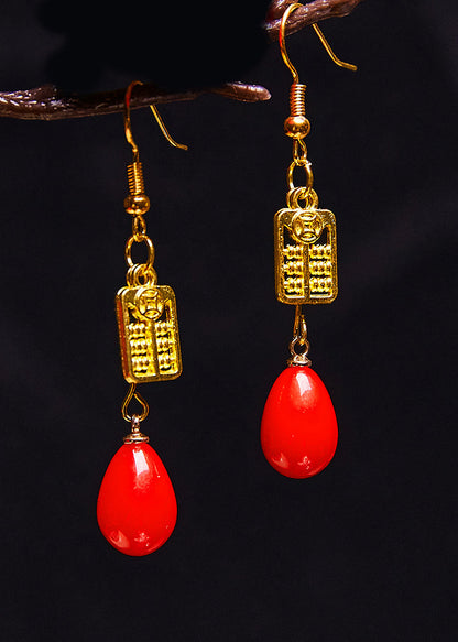 Elegantes aretes colgantes de ábaco en oro de 14 quilates y coral rojo