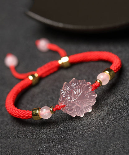 Elegante pulsera con dijes de piedras preciosas de cristal tejidas a mano en rojo