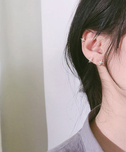 Elegante pendiente con hexagrama de circonitas doradas y cobre en oro rosa