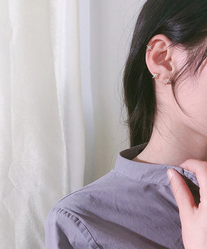 Elegante pendiente con hexagrama de circonitas doradas y cobre en oro rosa