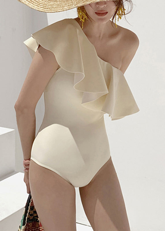 Trendige beige One-Shoulder-Bodys mit Rüschen, Patchwork-Details und Cut-Outs