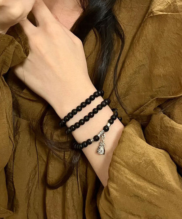 Pulsera única con dije de bolsa de bendición de cuentas de Buda negro