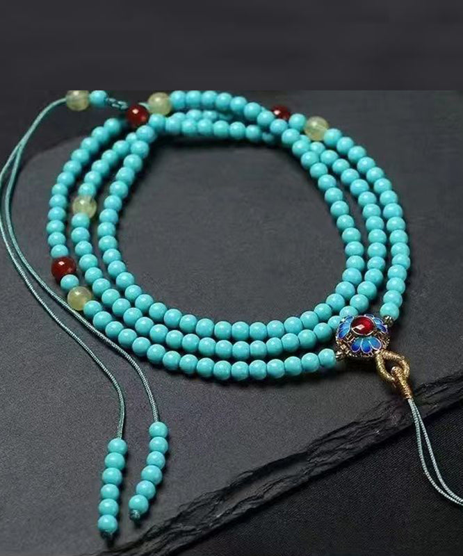 Collar con colgante de borla de cera de abejas, jade turquesa y aleación azul única