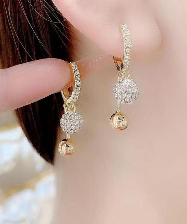 Pendientes colgantes únicos de cobre dorado con incrustaciones de circonita