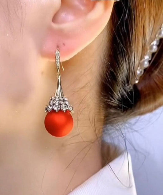 Pendientes únicos de plata de ley verde con circonitas doradas y forma de ojo de gato