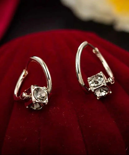 Einzigartige Ohrringe aus grauer Legierung mit Zirkonkristallen