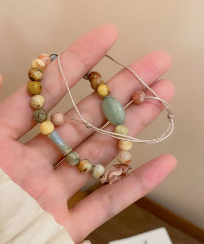 Einzigartiges, handgestricktes, zweiteiliges Armbandset mit Rosenperlen und Edelsteinen