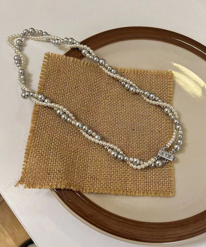 Collar único de acero inoxidable con perlas de doble capa y cuentas graduadas