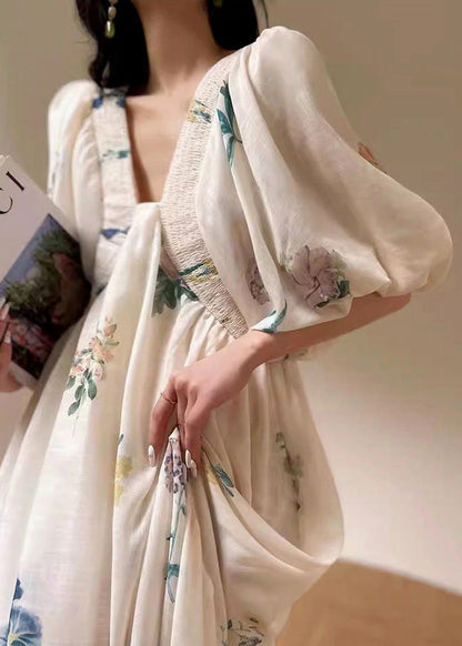 Weißes Baumwollkleid mit Puffärmeln und Print im Urlaubsstil