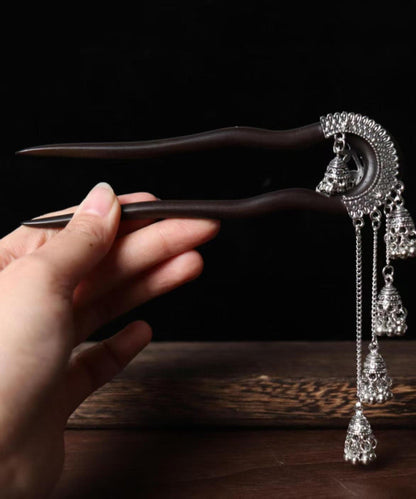 Vintage Haarnadel mit schwarzer Holzquaste und Glockenmotiv