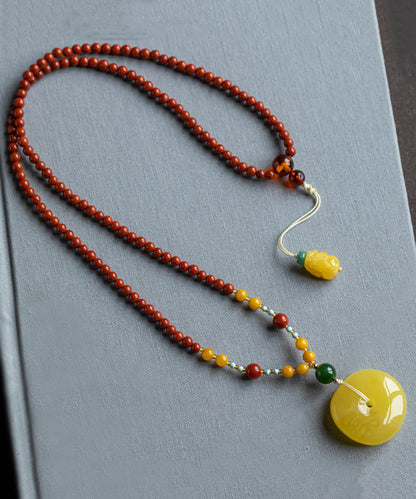 Collar vintage con colgante de cera de abejas y ágata roja tejida a mano