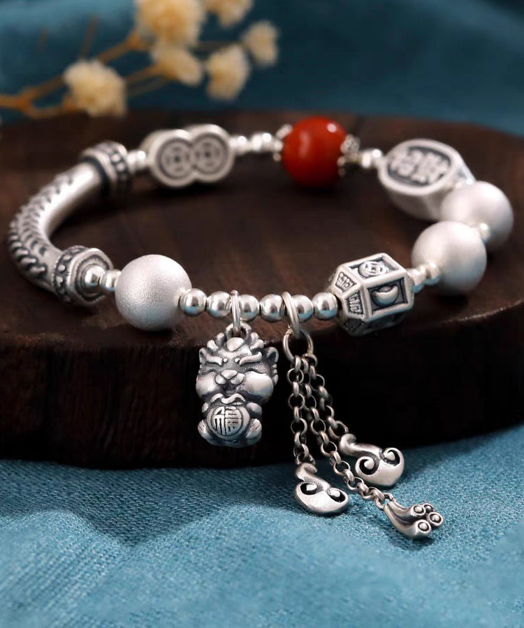 Pulsera vintage de seda con borlas de ágata y plata de ley