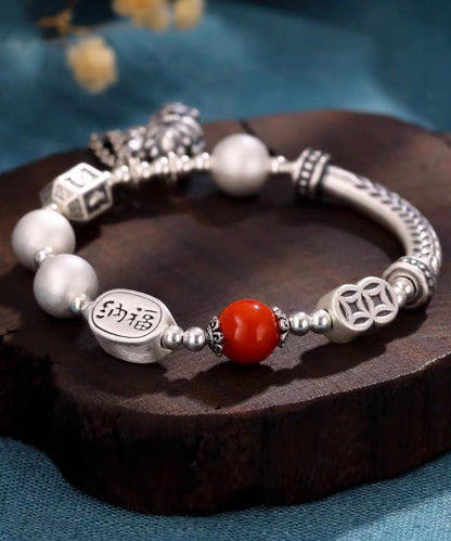 Pulsera vintage de seda con borlas de ágata y plata de ley