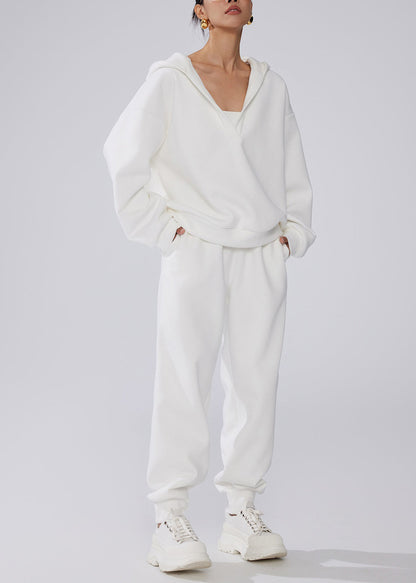 Conjunto de dos piezas de forro polar cálido con cintura elástica y bolsillos blancos y capucha para invierno.