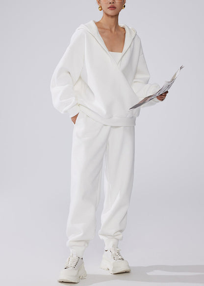 Conjunto de dos piezas de forro polar cálido con cintura elástica y bolsillos blancos y capucha para invierno.