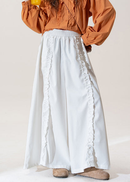 Pantalones de algodón de cintura alta, pierna ancha y bolsillos blancos con volantes