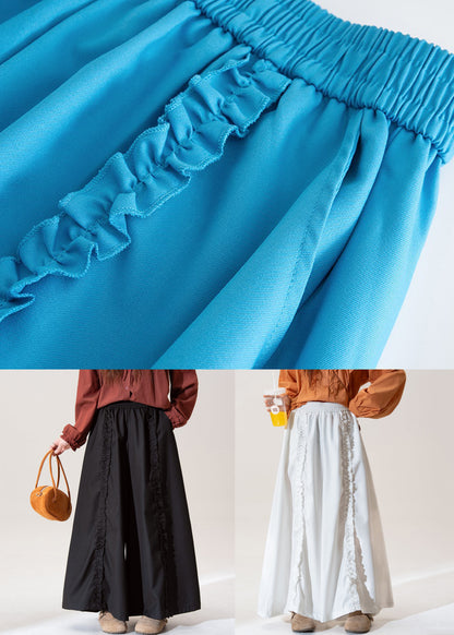 Pantalones de algodón de cintura alta, pierna ancha y bolsillos blancos con volantes