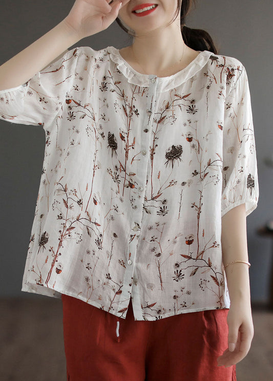 Blusa de lino con estampado patchwork blanco y volantes de media manga