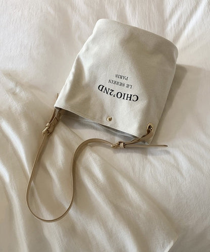 Bolso de hombro de lona de gran capacidad con letras beige para mujer