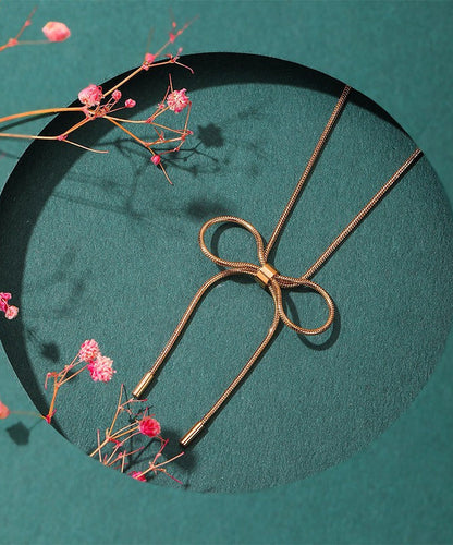 Collar de princesa con lazo dorado en plata de ley para mujer