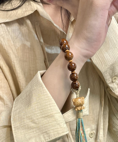 Pulsera con borlas y cuentas tejidas a mano para mujer