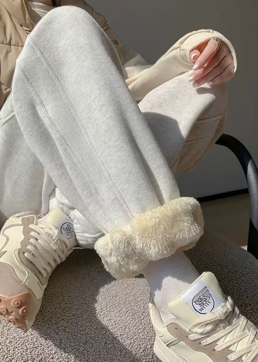 Damen hellgraue Fleecehose mit Taschen, elastischem Bund und warmem Stoff für den Winter