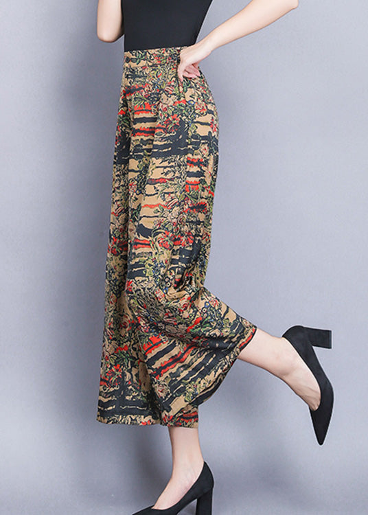 Pantalones anchos de seda con cintura elástica y estampado amarillo para verano