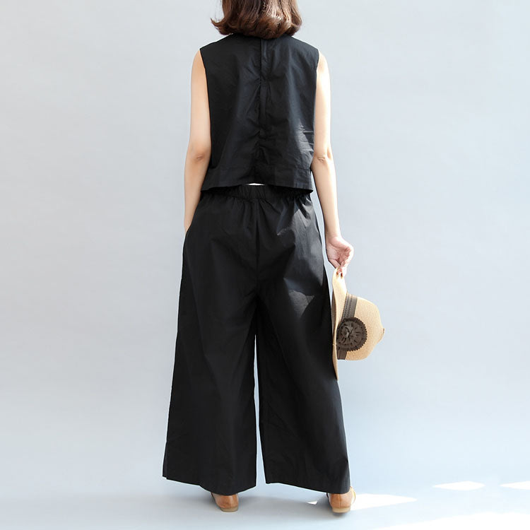 schwarze stylische Leinenhosen, lässige ärmellose Oberteile und lockere Jumpsuit-Hosen