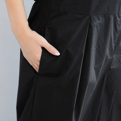 schwarze stylische Leinenhosen, lässige ärmellose Oberteile und lockere Jumpsuit-Hosen