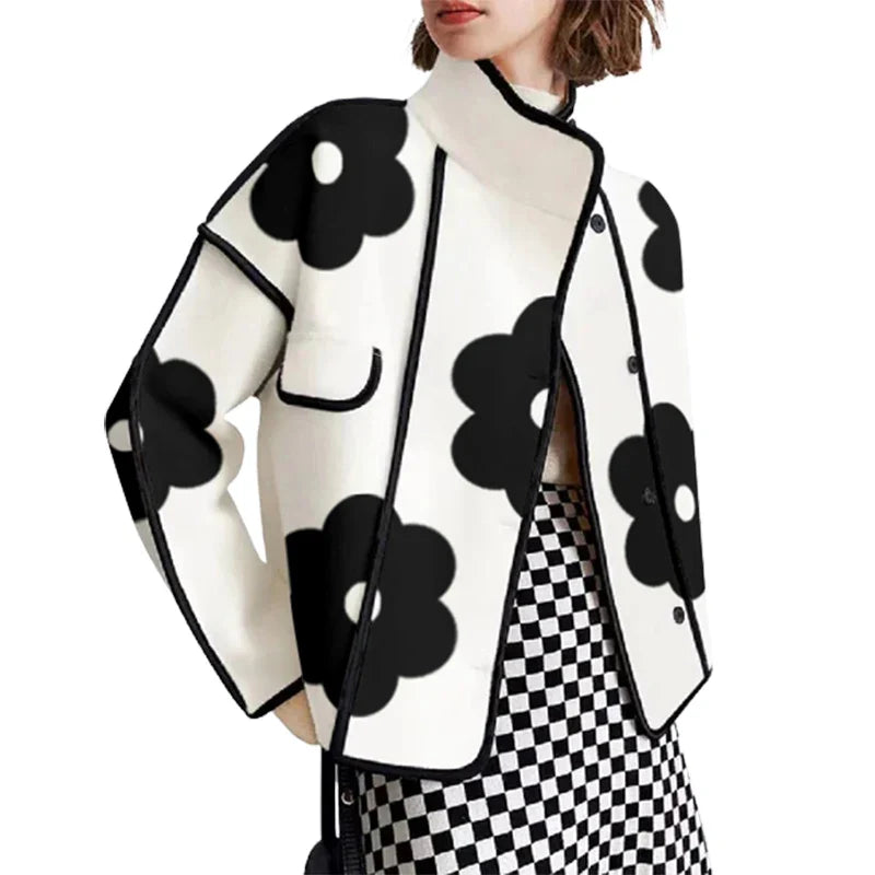 Black and white floral print top with contrasting trim and loose fit