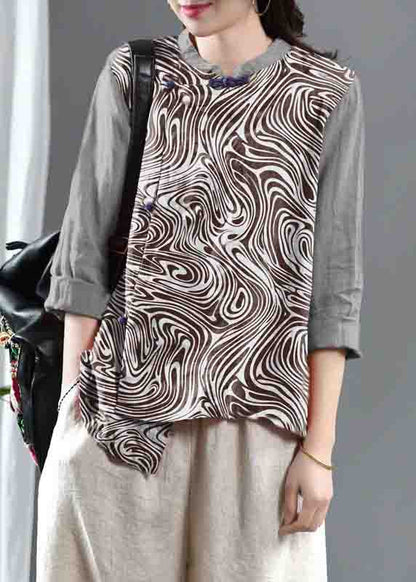 Lockeres, orangefarbenes, besticktes Leinenoberteil mit Blumenmuster und halblangen Ärmeln