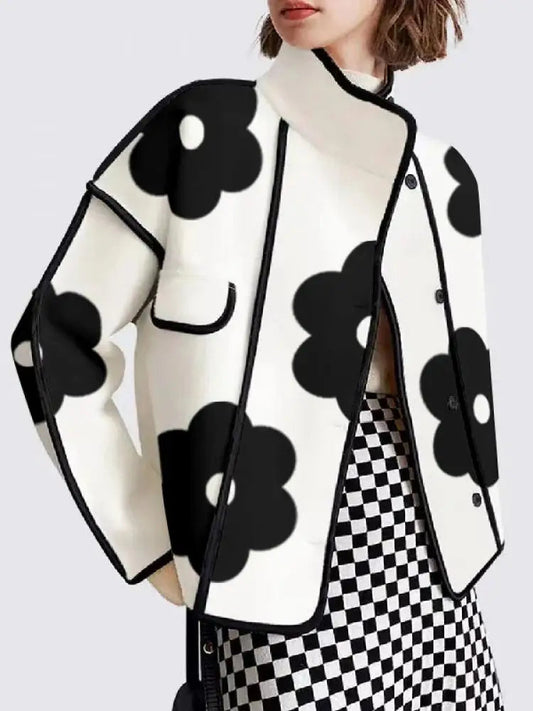 Black and white floral print top with contrasting trim and loose fit